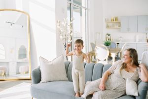 toddler plays on couch during Nashville family photos