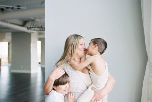 mom hugs sons during Nashville family photos on film