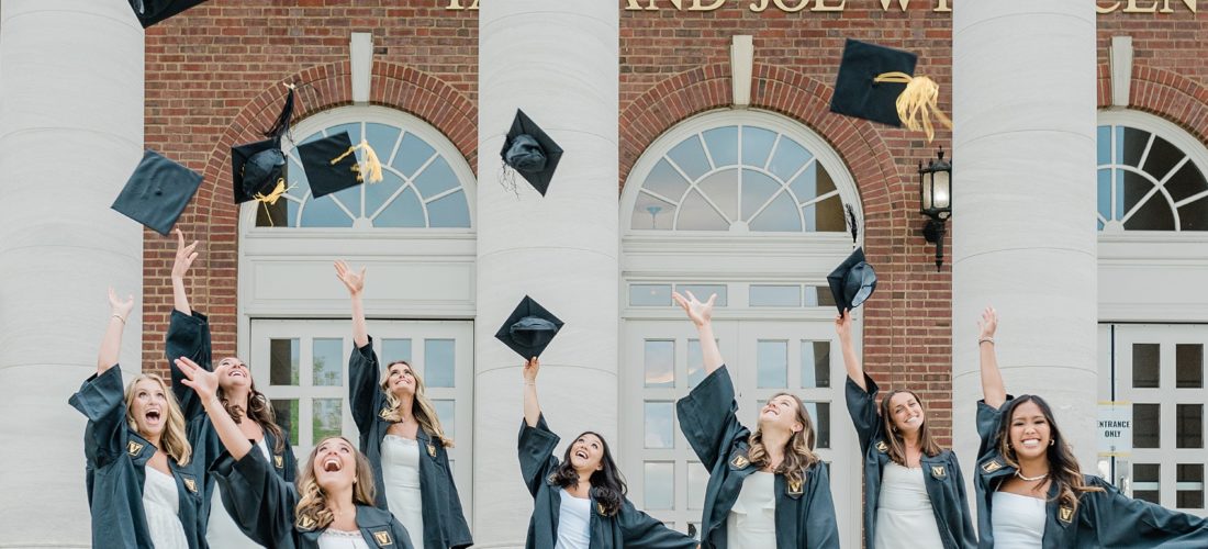 seniors toss caps in the air during Vanderbilt University graduate portraits