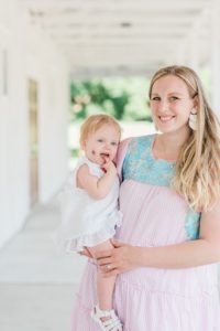 mom holds birthday girl during family photos