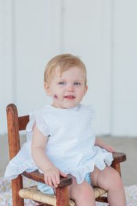 toddler smiles during Nashville first birthday portraits