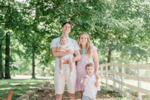 family of four stands together during Nashville famil yphotos
