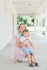 mom sits with son during family photos in Nashville