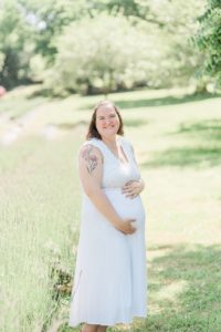 mom holds belly during Lavender Field Mini Sessions