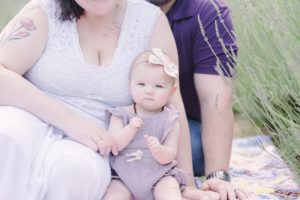 toddler sits with parents during Lavender Field Mini Sessions