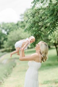 mom lifts baby during Tennessee family photos