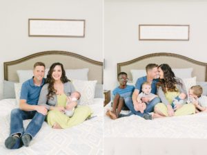 mom and dad sit on bed with sons
