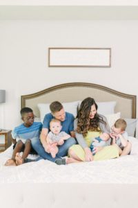 parents hold four boys during Nashville lifestyle newborn session