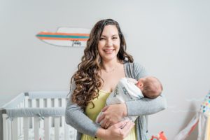 mom holds baby boy during Nashville lifestyle newborn session