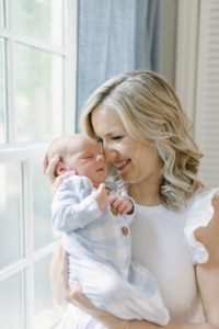 mom nuzzles baby boy during Nashville newborn portraits