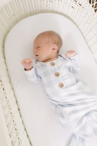 baby lays in crib during Nashville newborn portraits