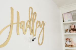 gold sign with baby's name in Nashville nursery