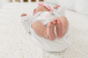 baby's feet in the air during Nashville newborn session at home