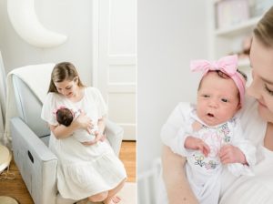 mom looks at baby girl during photos at home
