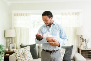 dad holds daughter during TN newborn photos