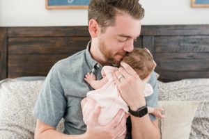 dad rocks baby girl during Franklin TN newborn session