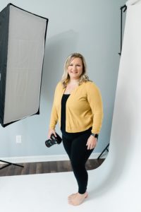 photographer poses in home studio during Nashville personal branding session