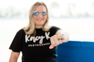 photographer wears class rings during Nashville personal branding session