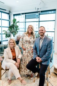 three team members stand together during Nashville team branding portraits