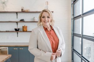woman stands in kitchen during Nashville team branding portraits