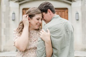 woman hugs husband's arm during family photos in Tennessee