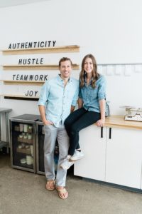 couple stands in kitchen in Nashville TN bakery