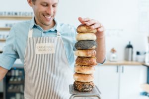 bagel company stacks bagels during branding photos