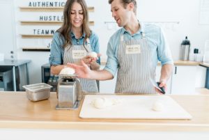 husband and wife prepare bagels during Nashville branding photography session