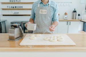 baker prepares sourdough bagels during Nashville branding photography session