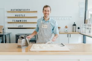 baker stands by dough at Crieve Hall Bagel Co.