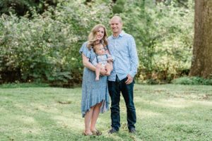 family poses in yard during West Nashville family portraits