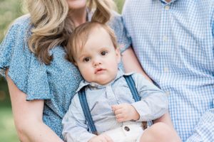 parents hold toddler during West Nashville family portraits