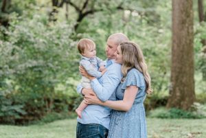 parents talk to son during family photos in Nashville