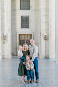 family of four hugs during War Memorial fall mini sessions