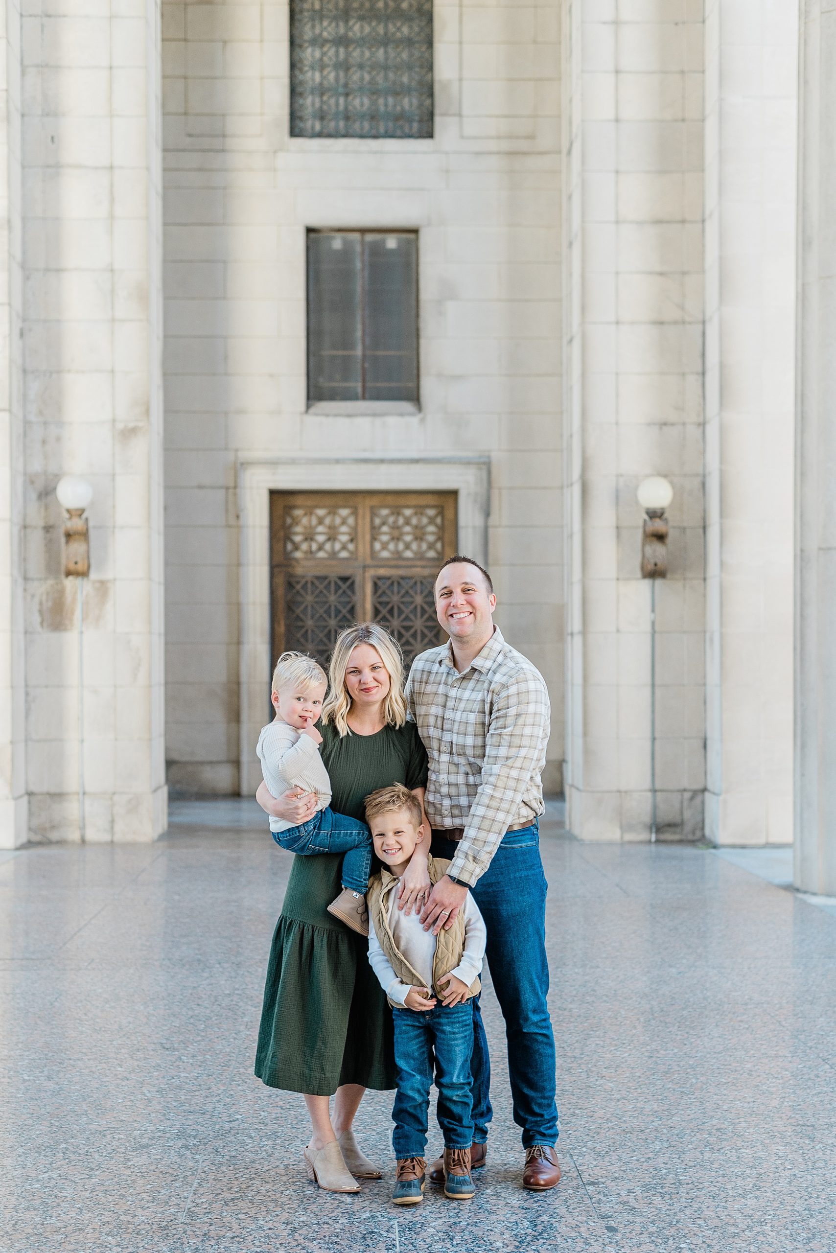 family of four hugs during War Memorial fall mini sessions