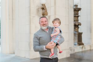 dad holds toddler during Nashville family photos