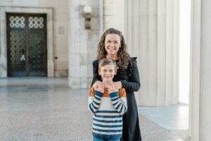 mom stands behind son during War Memorial fall mini sessions