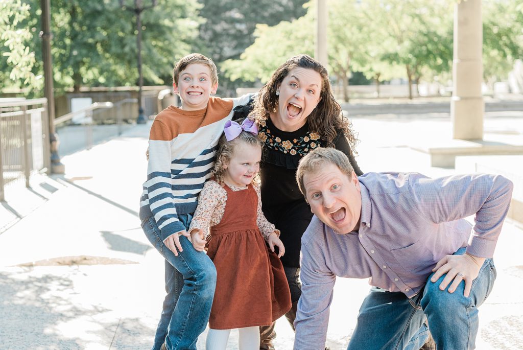 family makes silly face during fall mini session