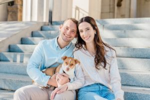 couple sits with dog during Nashville mini sessions