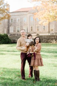 family of four poses on lawn at Cheekwood Estate
