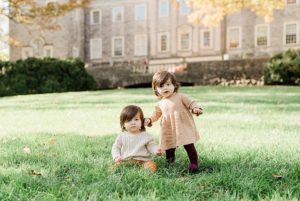 toddlers pose in grass during Cheekwood Estate family portraits