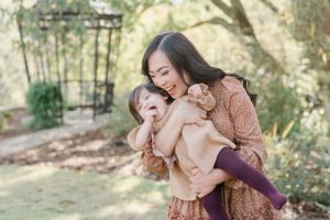 mom makes daughter laugh during Cheekwood Estate family portraits