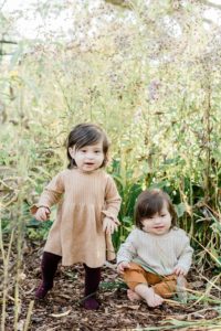 toddler plays in garden during fall Cheekwood Estate family portraits