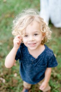 toddler shows off curls during Nashville family portraits