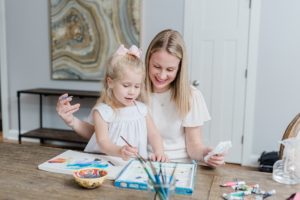 mom teaches daughter to paint during Nashville branding session