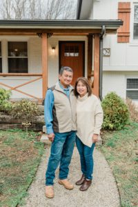parent pose together outside Nashville cabin