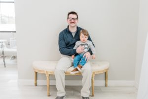 dad holds son during Nashville studio family portraits