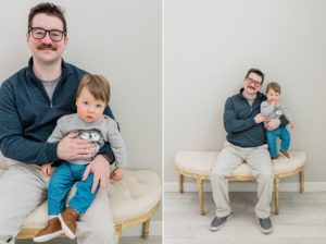 dad cuddles with son during family photos in studio