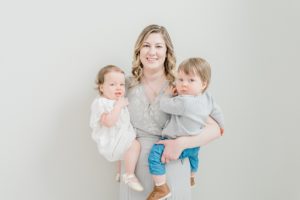 mom holds twins during studio family photos in Nashville TN