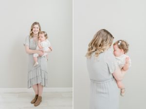 mom hugs daughter during studio milestone one photos for first birthday